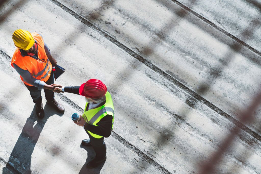Newly employed workers shaking hands